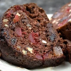 Chocolate Fruit Cake with Brandy Syrup - Saffarazzi Slice of chocolate fruit cake with dried fruit and brandy syrup.
