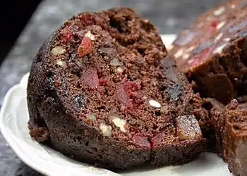Chocolate Fruit Cake with Brandy Syrup - Saffarazzi Slice of chocolate fruit cake with dried fruit and brandy syrup.