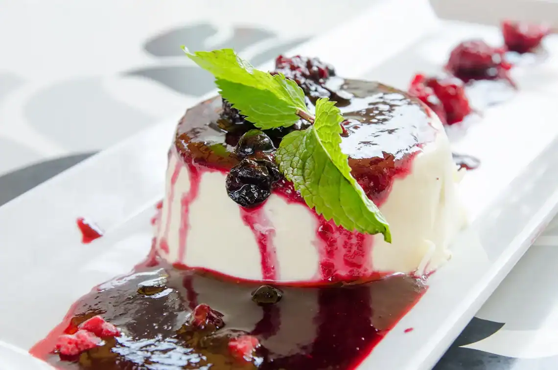 Buttermilk-panna-cottajpg - Saffarazzi Buttermilk panna cotta served with spiced plums and citrus sauce