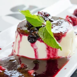 Buttermilk-panna-cottajpg - Saffarazzi Buttermilk panna cotta served with spiced plums and citrus sauce