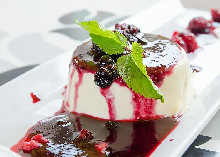 Buttermilk-panna-cottajpg - Saffarazzi Buttermilk panna cotta served with spiced plums and citrus sauce