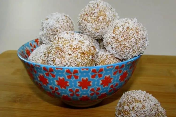 Balls of Caramel, Cream and Vanilla Cake Rolled in Coconut