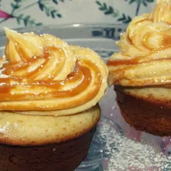 Vanilla Cupcakes Topped with a Swirl of Caramel Cream Cheese Icing