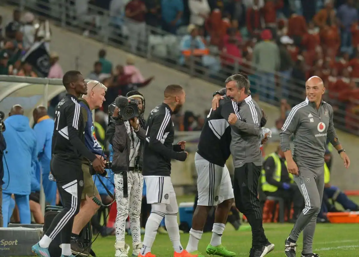 Orlando Pirates bench celebrating a win after final whistle