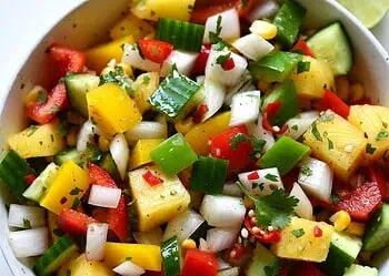 A vibrant, no-cook salad bursting with fresh peppers, sweet pineapple, crunchy corn, and zesty lime — the perfect healthy side dish for your next braai. Ready in 15 min.