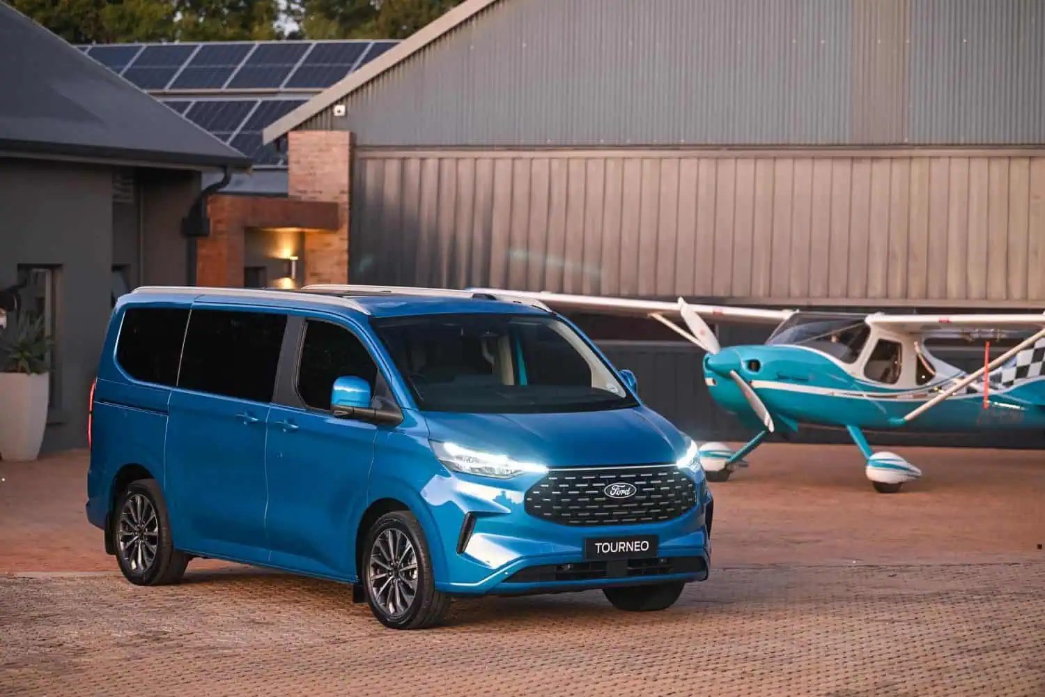 Ford Tourneo Titanium X AWD beside light aircraft - Saffarazzi Ford Tourneo Titanium X AWD beside light aircraft