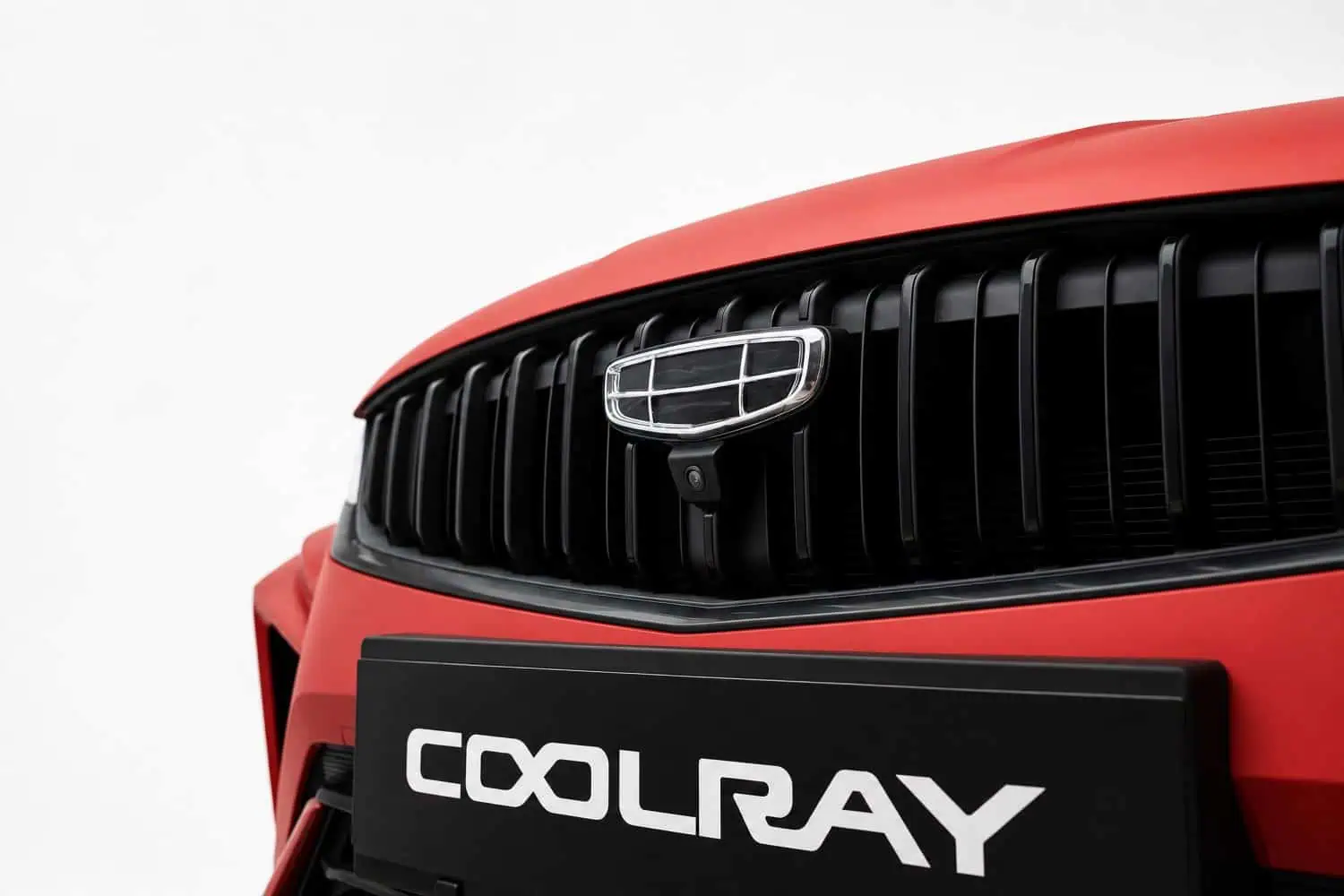 Geely Coolray grille badge and front camera detail - Saffarazzi Geely Coolray grille badge and front camera detail