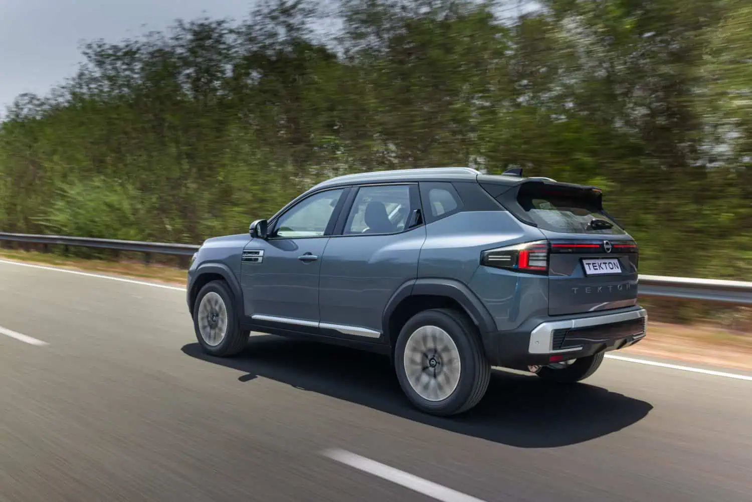Nissan Tekton compact SUV rear three-quarter view driving - Saffarazzi Nissan Tekton compact SUV rear three-quarter view driving