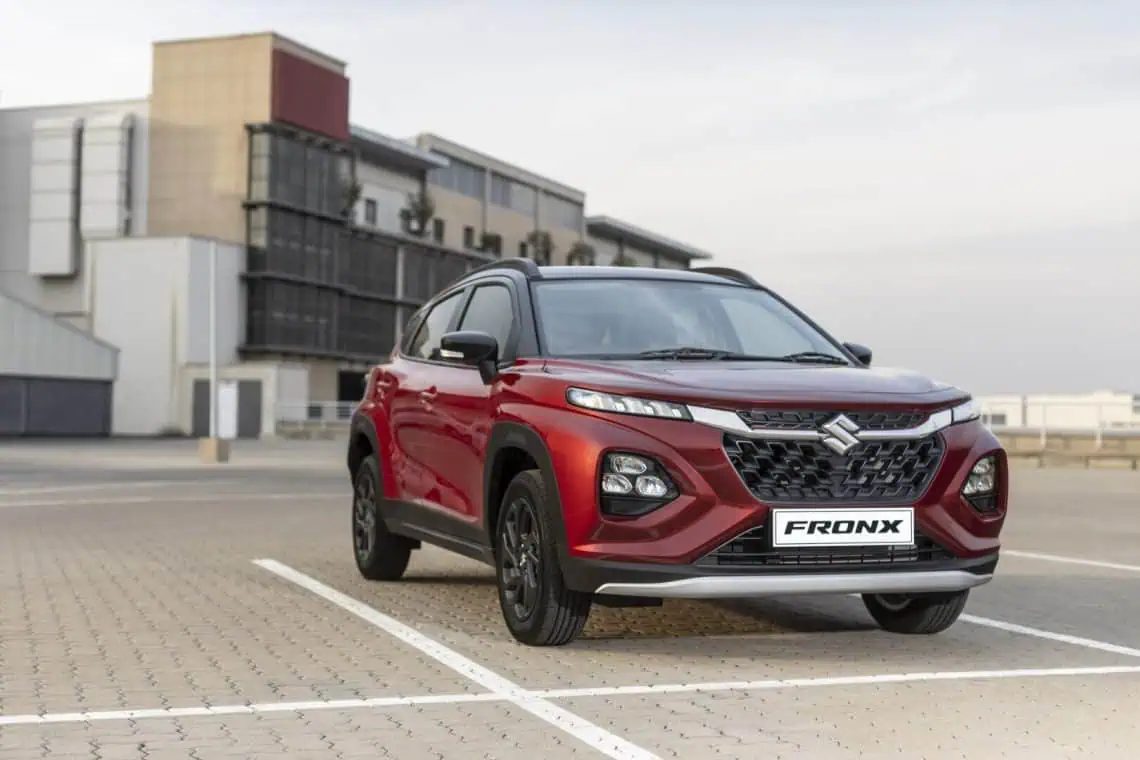 Red Suzuki Fronx crossover front three-quarter view