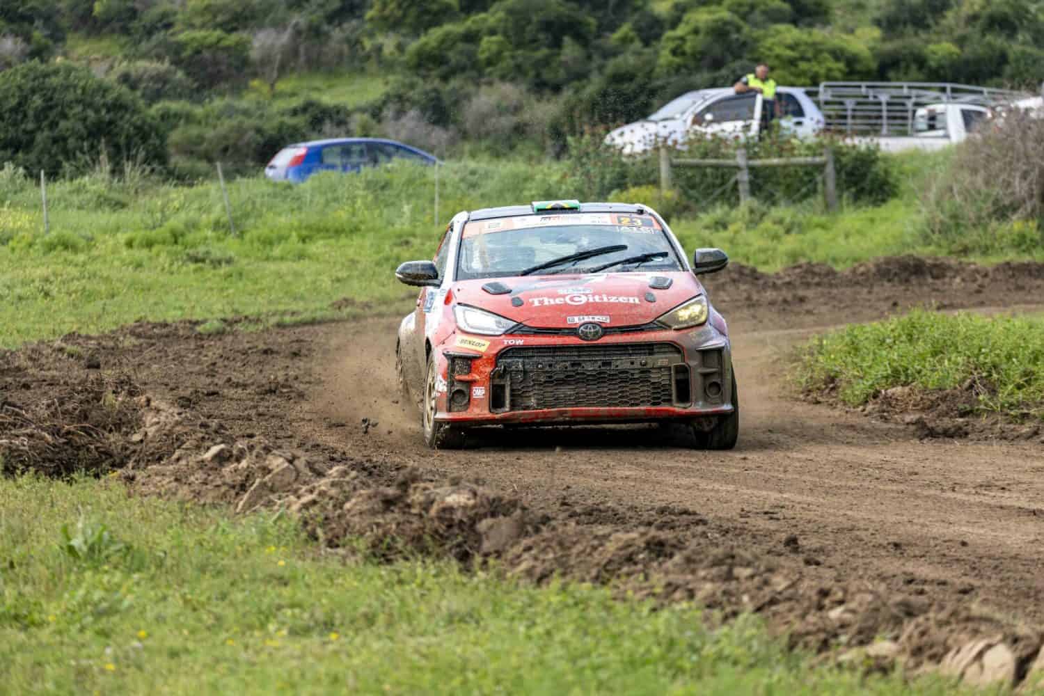 Toyota GR Yaris rally car front view on dirt road - Saffarazzi Toyota GR Yaris rally car front view on dirt road