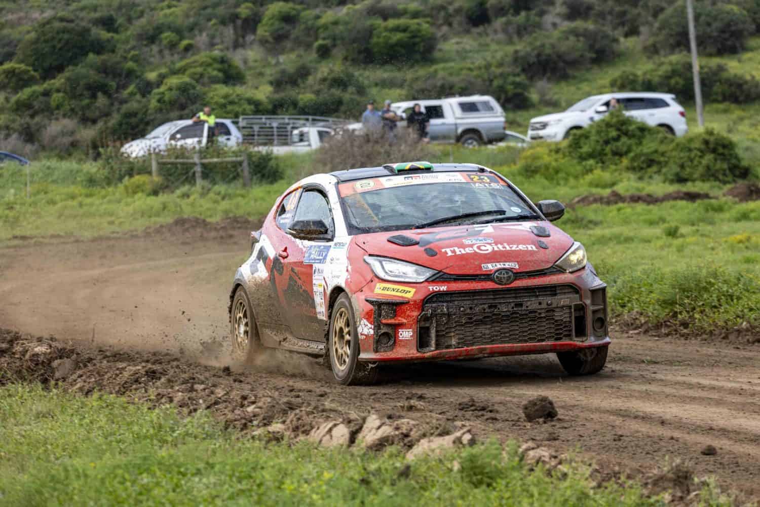 Toyota GR Yaris rally car kicking up dust in corner - Saffarazzi Toyota GR Yaris rally car kicking up dust in corner