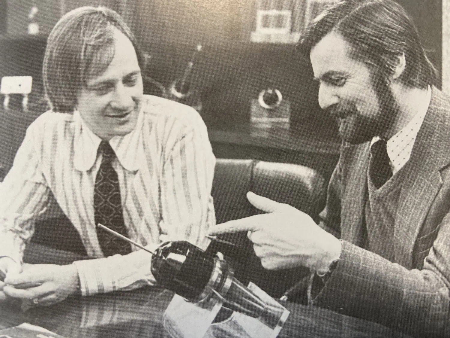 Archive office photograph - Saffarazzi Archive photograph of two men examining a model.