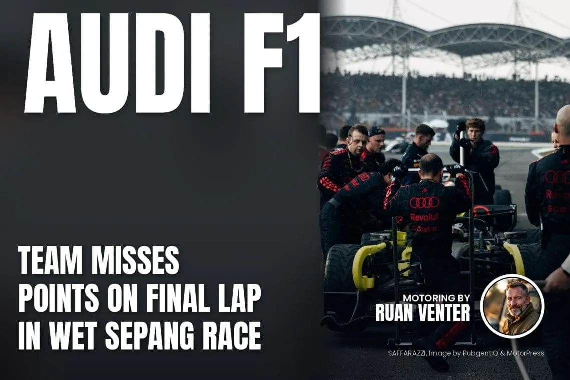 Audi R26 Formula 1 car on the Sepang grid with crew