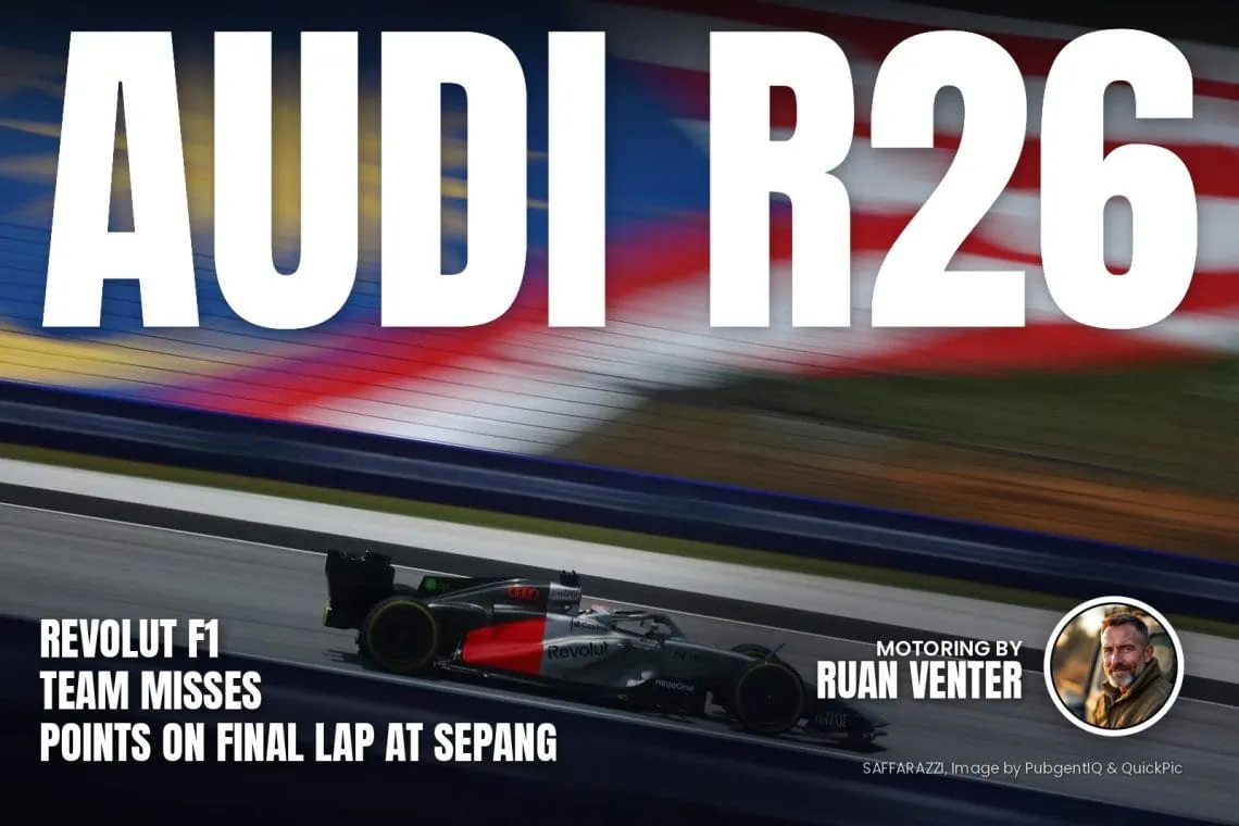 Audi R26 on track at Sepang with Malaysian flag