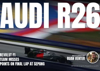 Audi R26 on track at Sepang with Malaysian flag