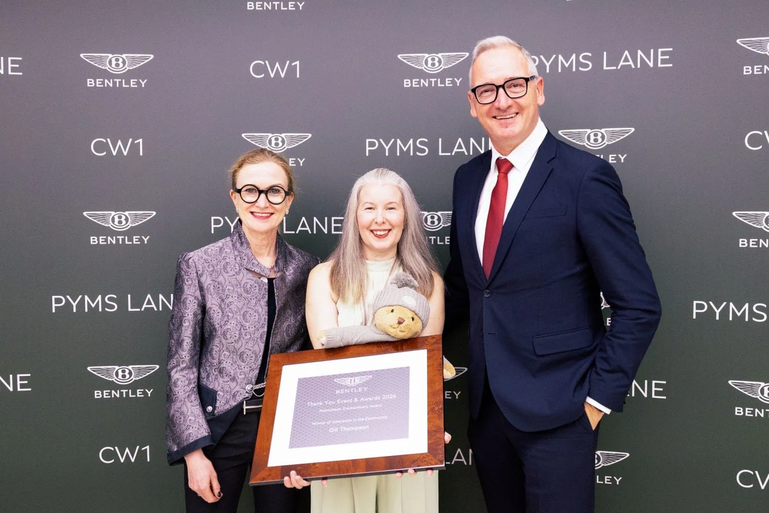 Bentley award recipient with framed certificate at Pyms Lane - Saffarazzi Bentley award recipient with framed certificate at Pyms Lane