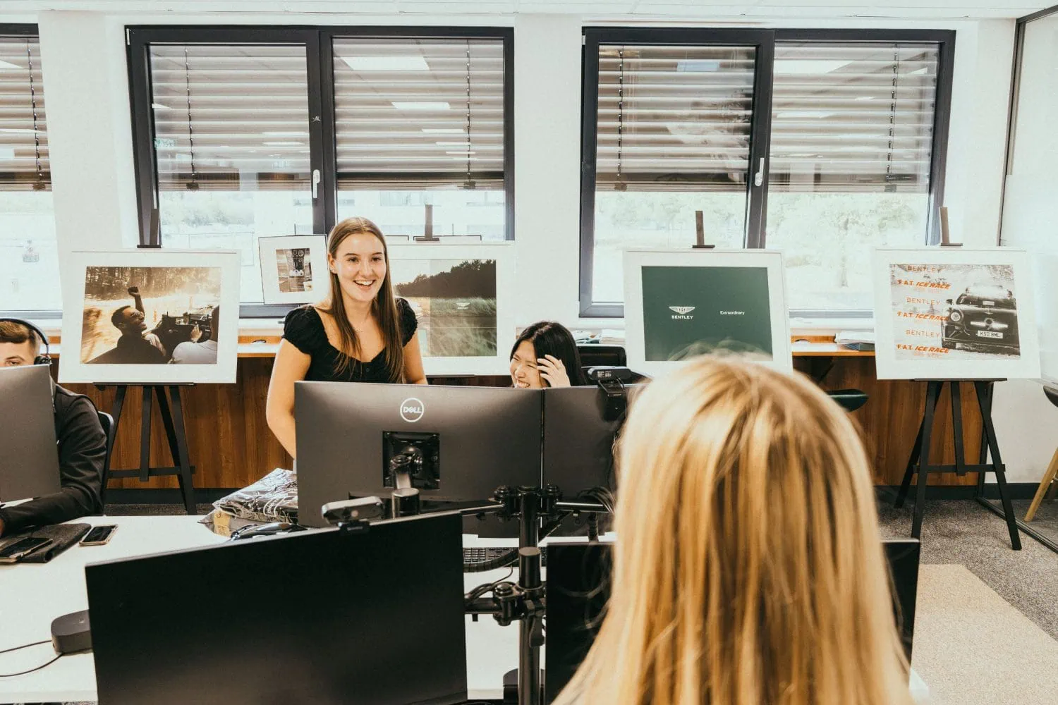 Bentley graduates working at desks in Crewe office - Saffarazzi Bentley graduates working at desks in Crewe office