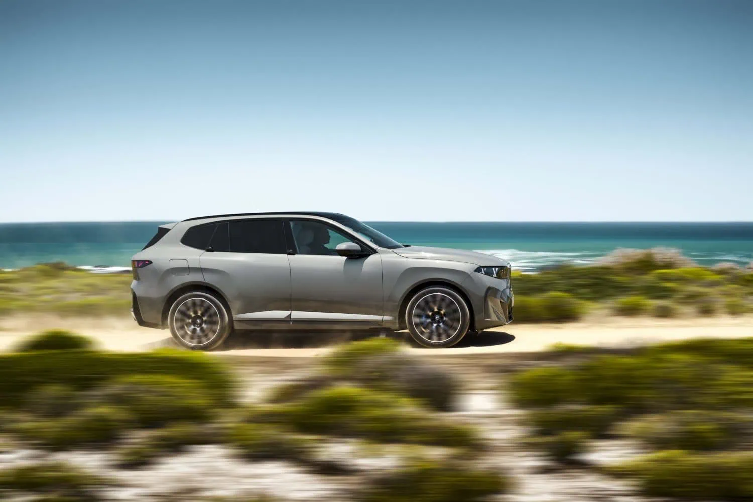 BMW X5 side profile driving past sea - Saffarazzi BMW X5 side profile driving past sea