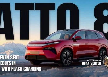 BYD ATTO 8 front three-quarter view in snowy mountains