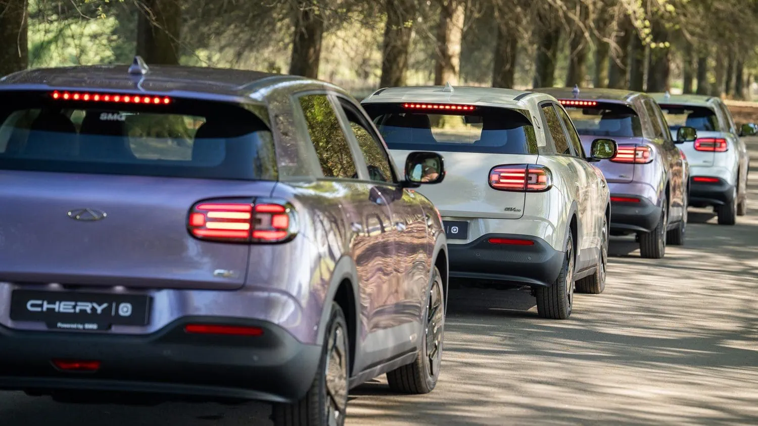 Chery Q convoy rear view on a forest road - Saffarazzi Chery Q convoy rear view on a forest road