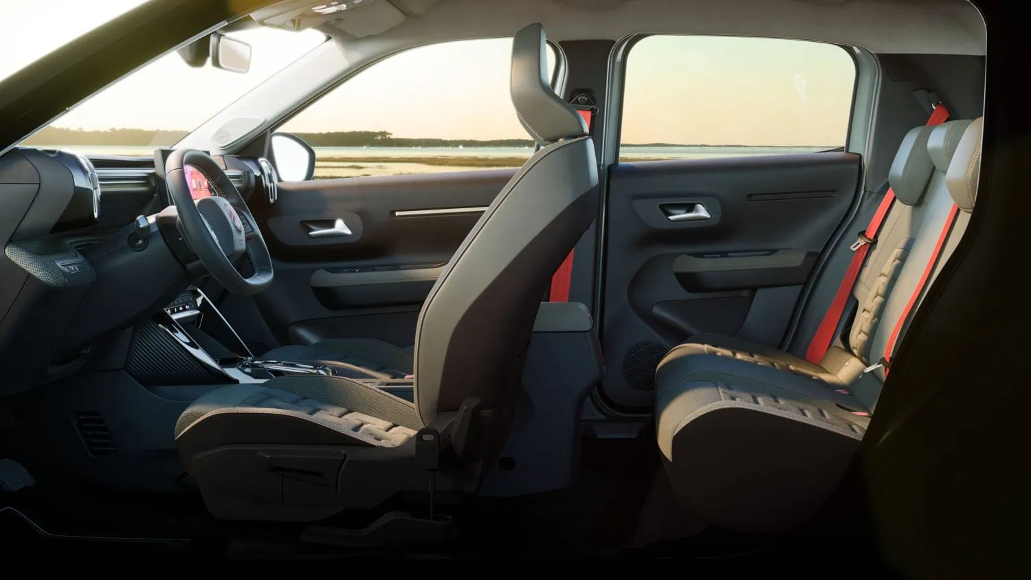 Citroën C3 OUTDOOR cabin side view with red seatbelts - Saffarazzi Interior of a modern car showing front seats, steering wheel, and rear seats with red seat belts, view to the outside landscape through the windows.