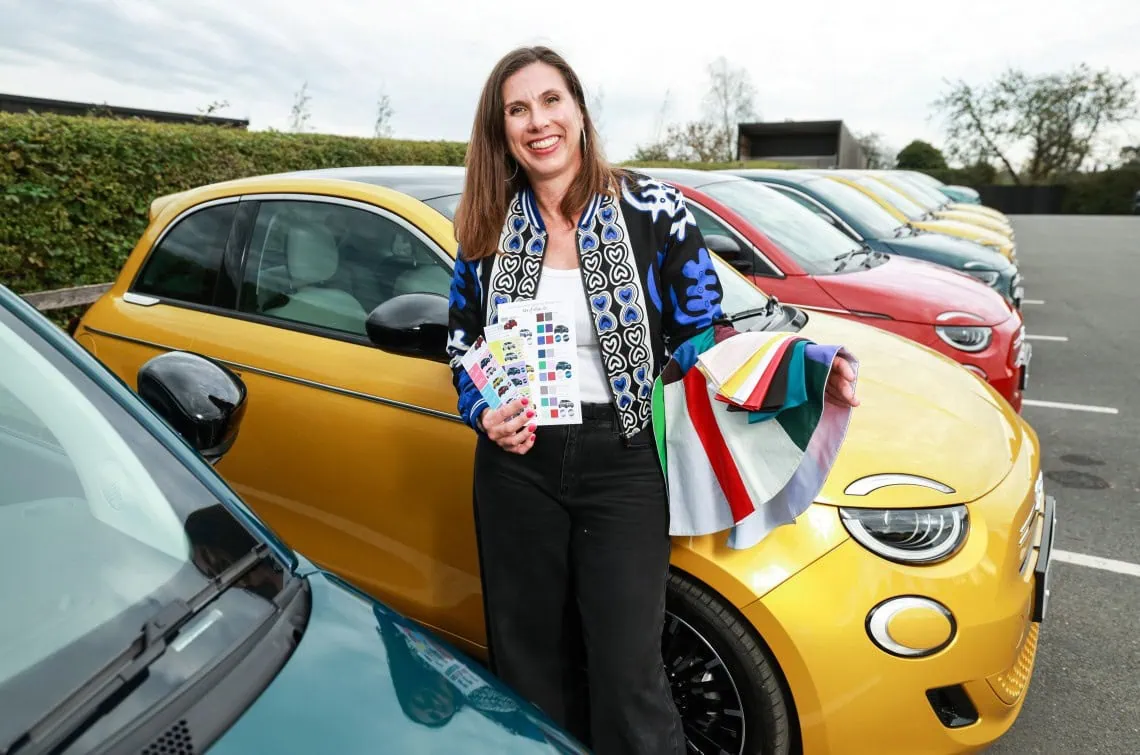 Consultant with yellow Fiat 500 - Saffarazzi Colour consultant with swatches beside yellow Fiat 500 Hybrid.