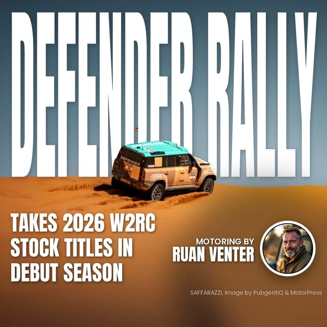 Land Rover Defender rally car climbing a desert sand dune