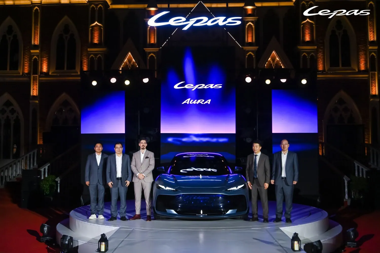 AURA Concept launch group - Saffarazzi Executives posing with LEPAS AURA Concept at reveal.