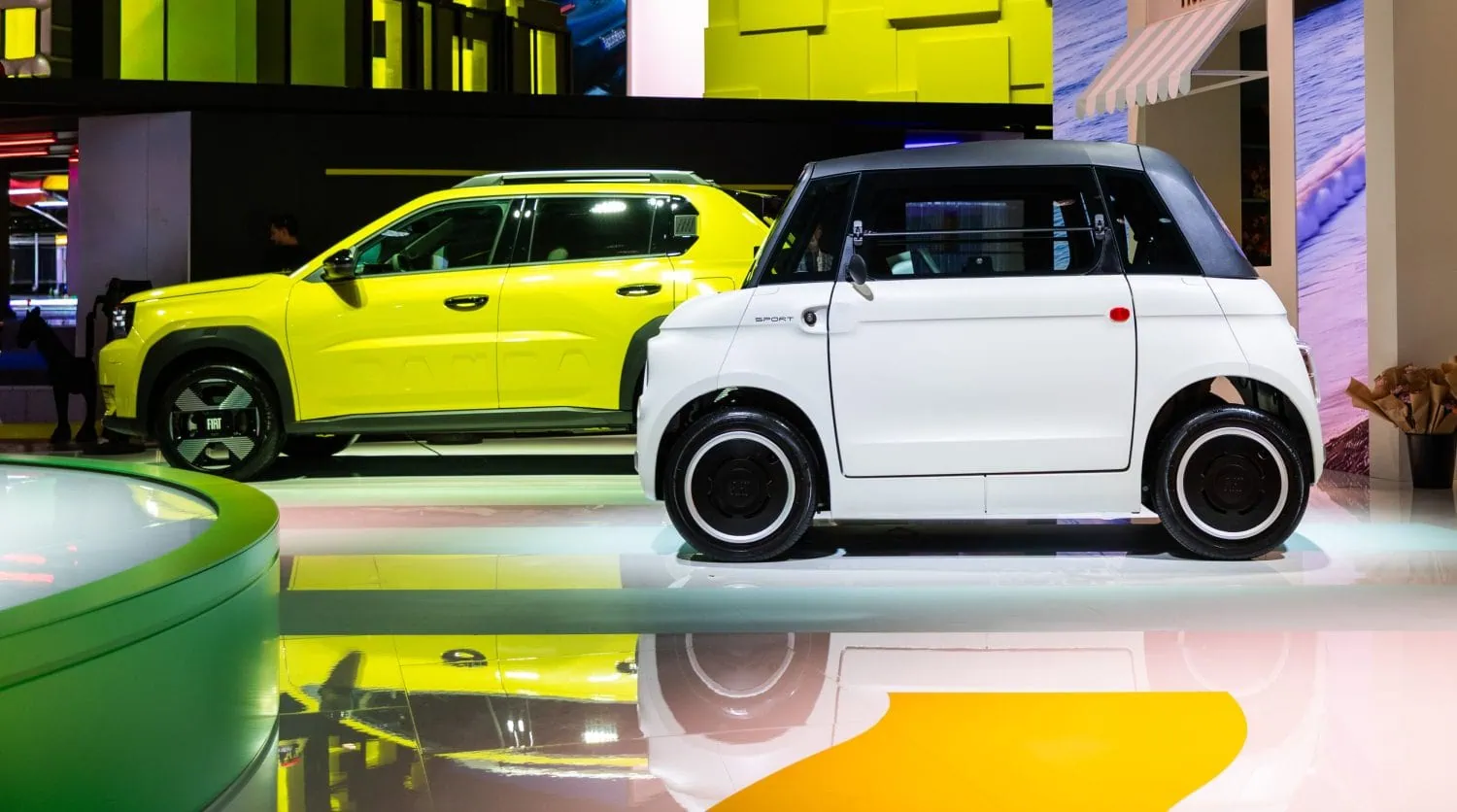 Fiat Topolino side view beside yellow Fiat SUV - Saffarazzi Fiat Topolino side view beside yellow Fiat SUV
