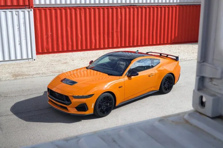 Ford Mustang GT elevated front view near shipping containers - Saffarazzi Ford Mustang GT elevated front view near shipping containers