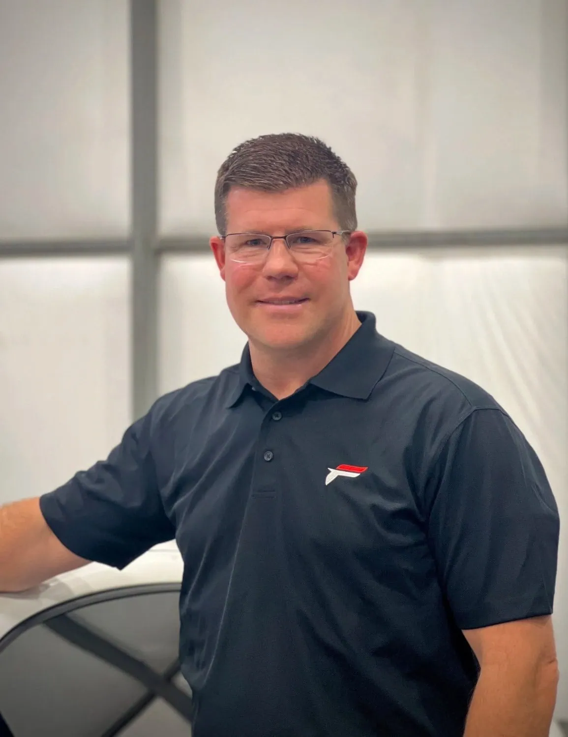 Forman Motorworks staff portrait - Saffarazzi Forman Motorworks representative posed in workshop portrait.