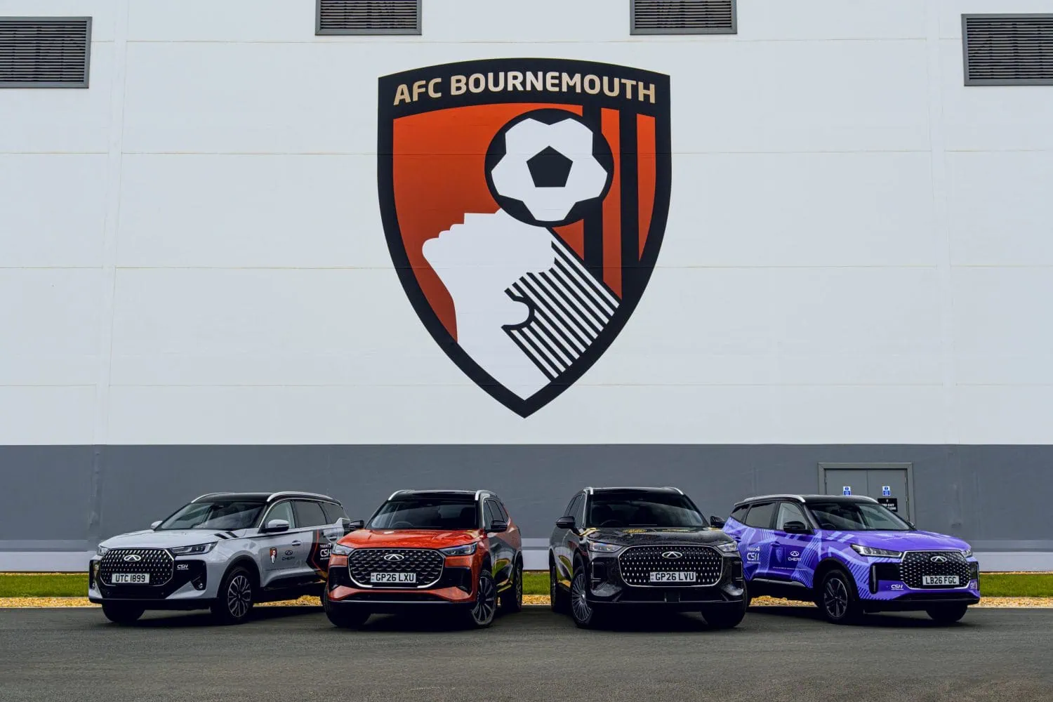 Four Chery SUVs parked below AFC Bournemouth crest - Saffarazzi Four Chery SUVs parked below AFC Bournemouth crest