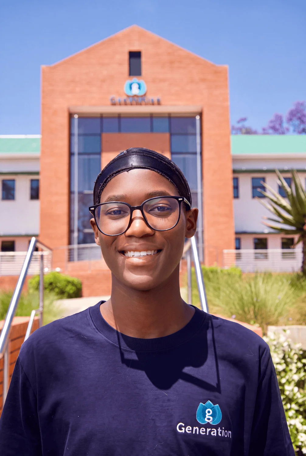 Student portrait outside campus - Saffarazzi GAC bursary student outside Generation campus building.