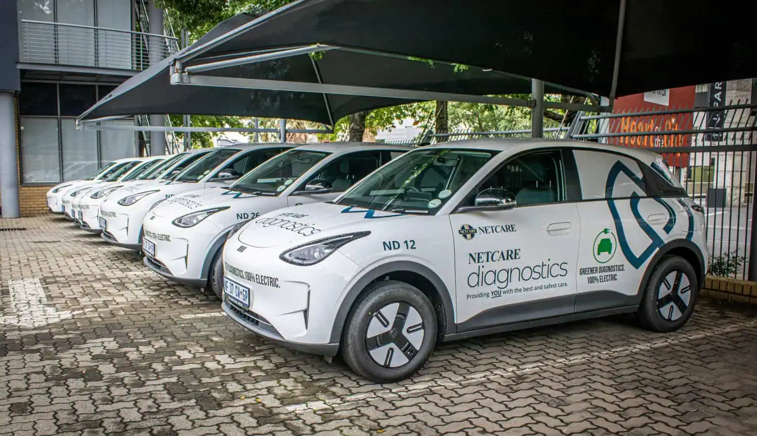 Geely E2 electric hatchbacks lined up under carports - Saffarazzi Geely E2 electric hatchbacks lined up under carports