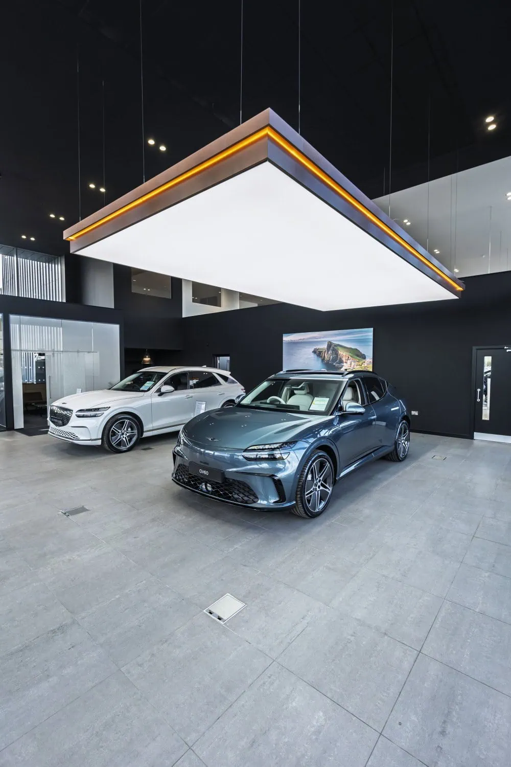 Genesis showroom display area - Saffarazzi Genesis GV60 and GV70 under showroom light feature.