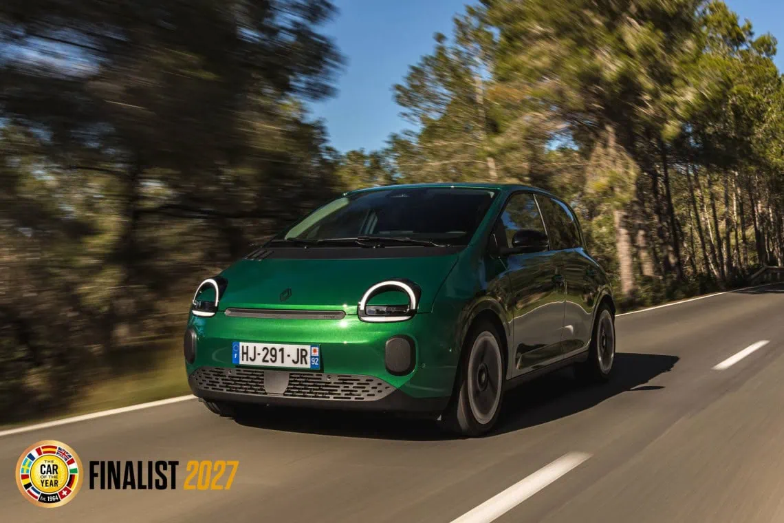 Renault Twingo E-Tech electric press photo 1 - Saffarazzi Green Renault Twingo E-Tech electric driving on road.