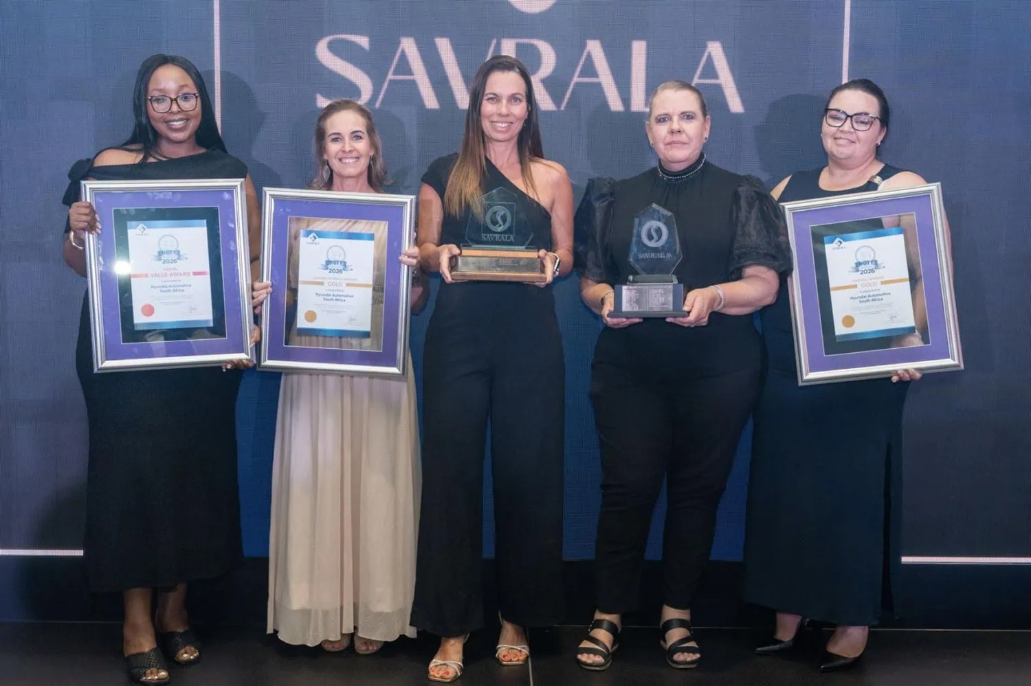 Hyundai staff with awards - Saffarazzi Hyundai team members holding SAVRALA awards and certificates.