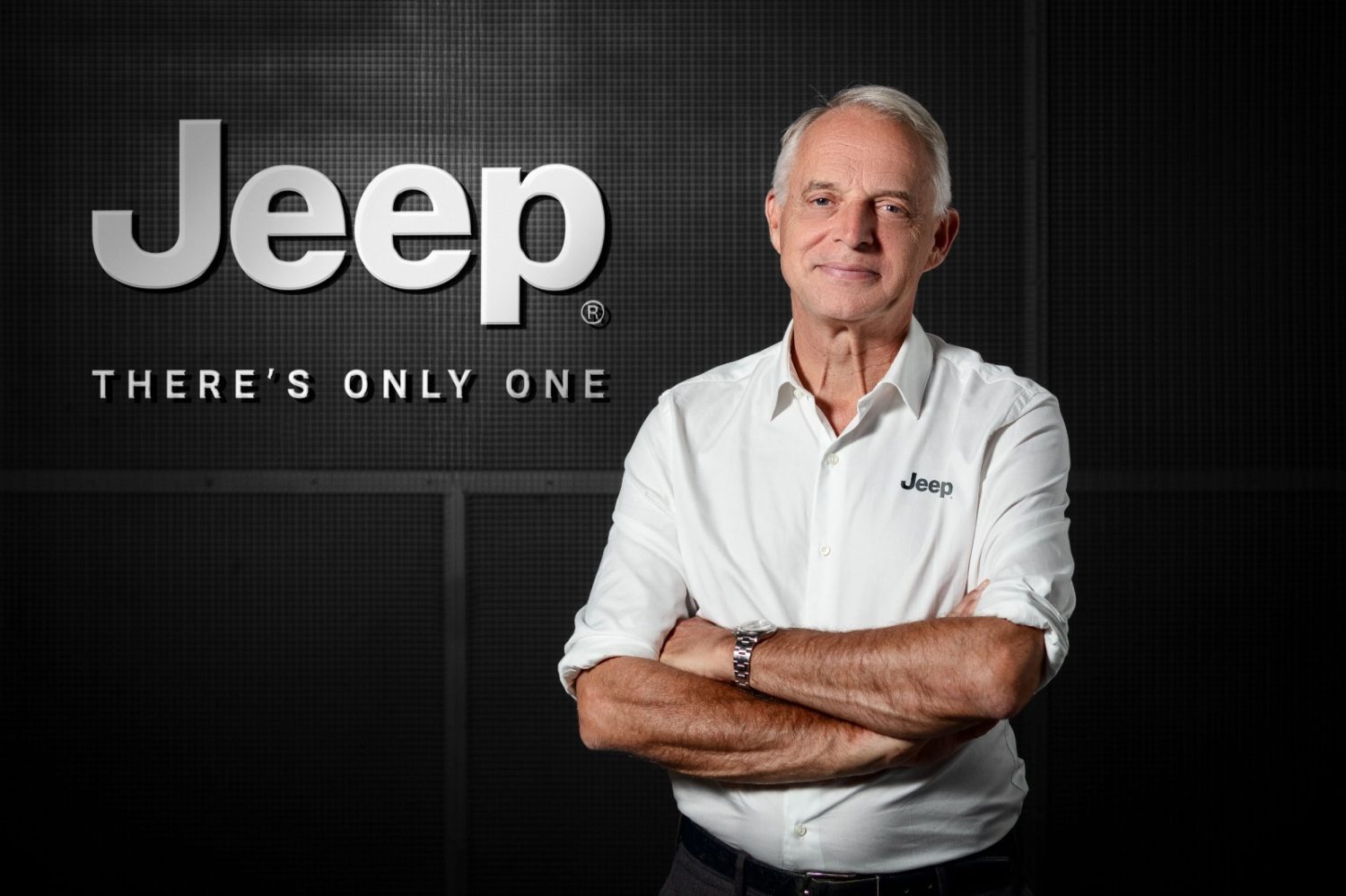 Jeep executive portrait in front of brand logo - Saffarazzi Jeep executive portrait in front of brand logo