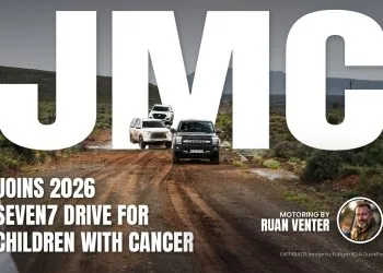 JMC bakkies driving a muddy gravel road on the Seven7 Drive