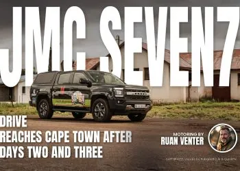 JMC pickup on Seven7 Drive outside old farm buildings