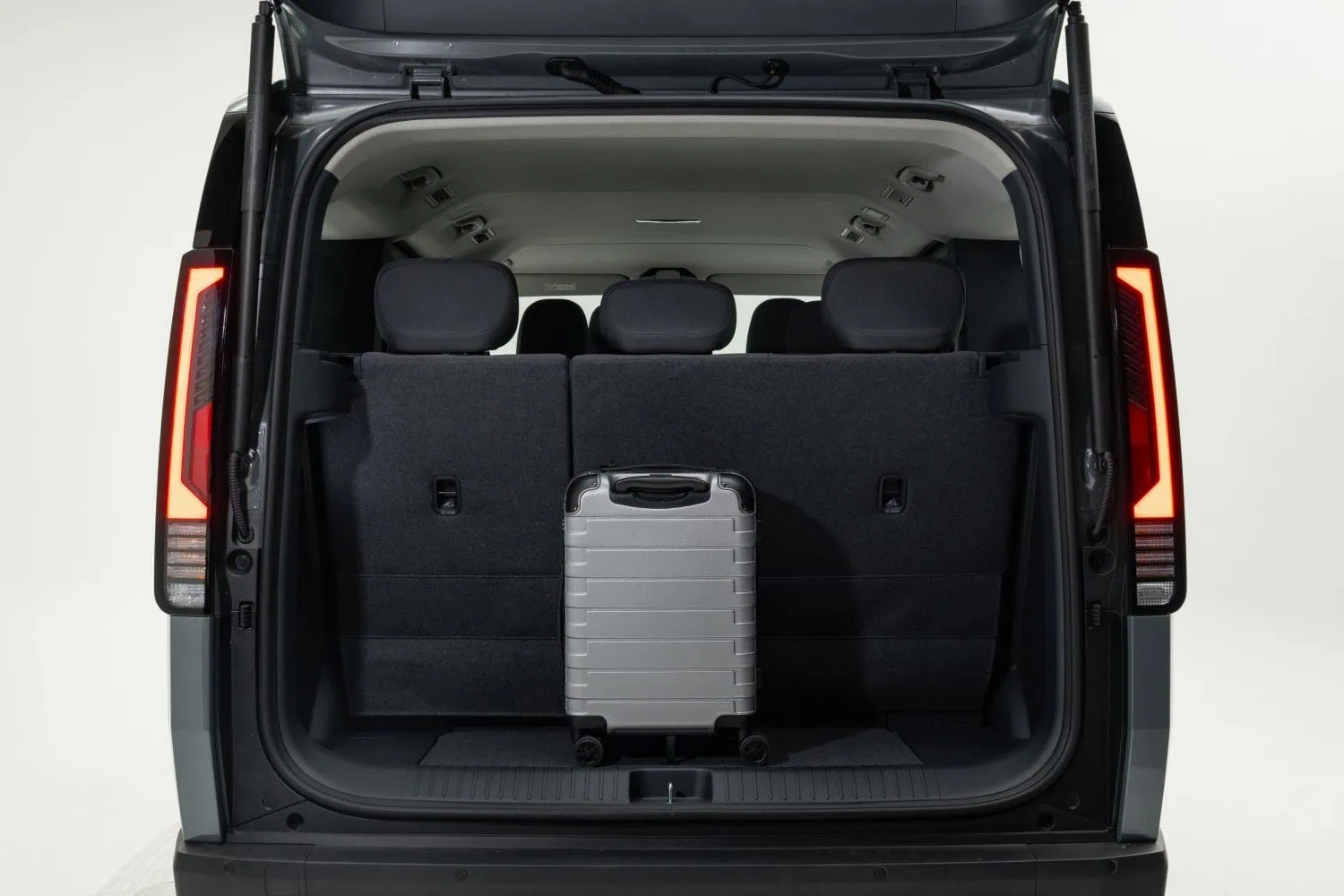 Kia PV5 Passenger boot space with suitcase - Saffarazzi Kia PV5 Passenger boot space with suitcase