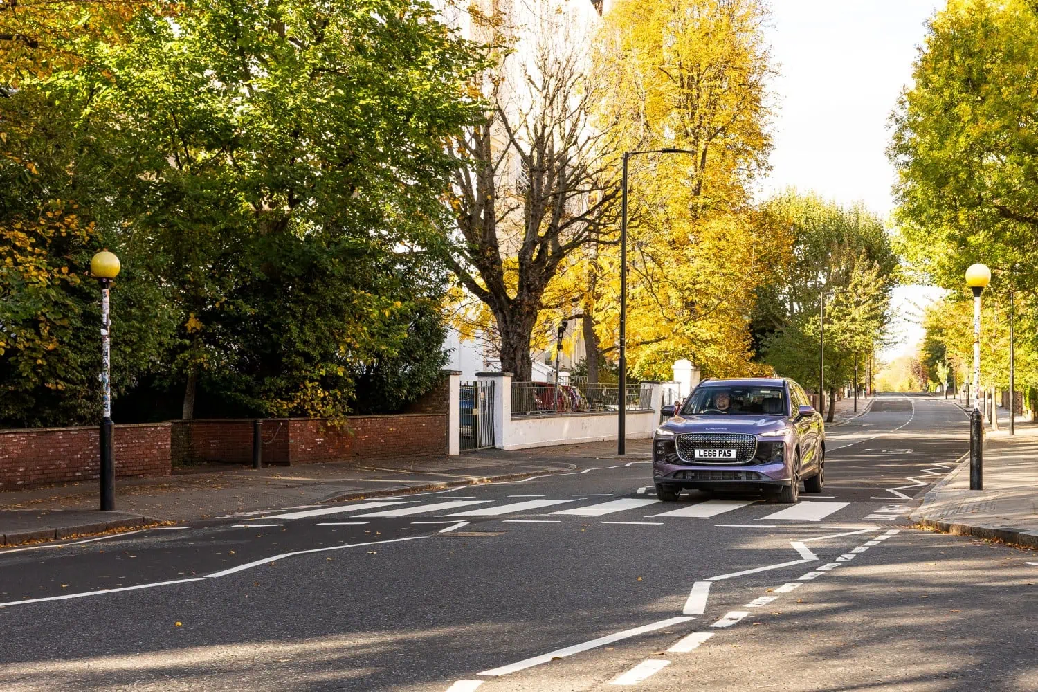 LEPAS SUV on autumn road - Saffarazzi LEPAS SUV approaching a zebra crossing in autumn.