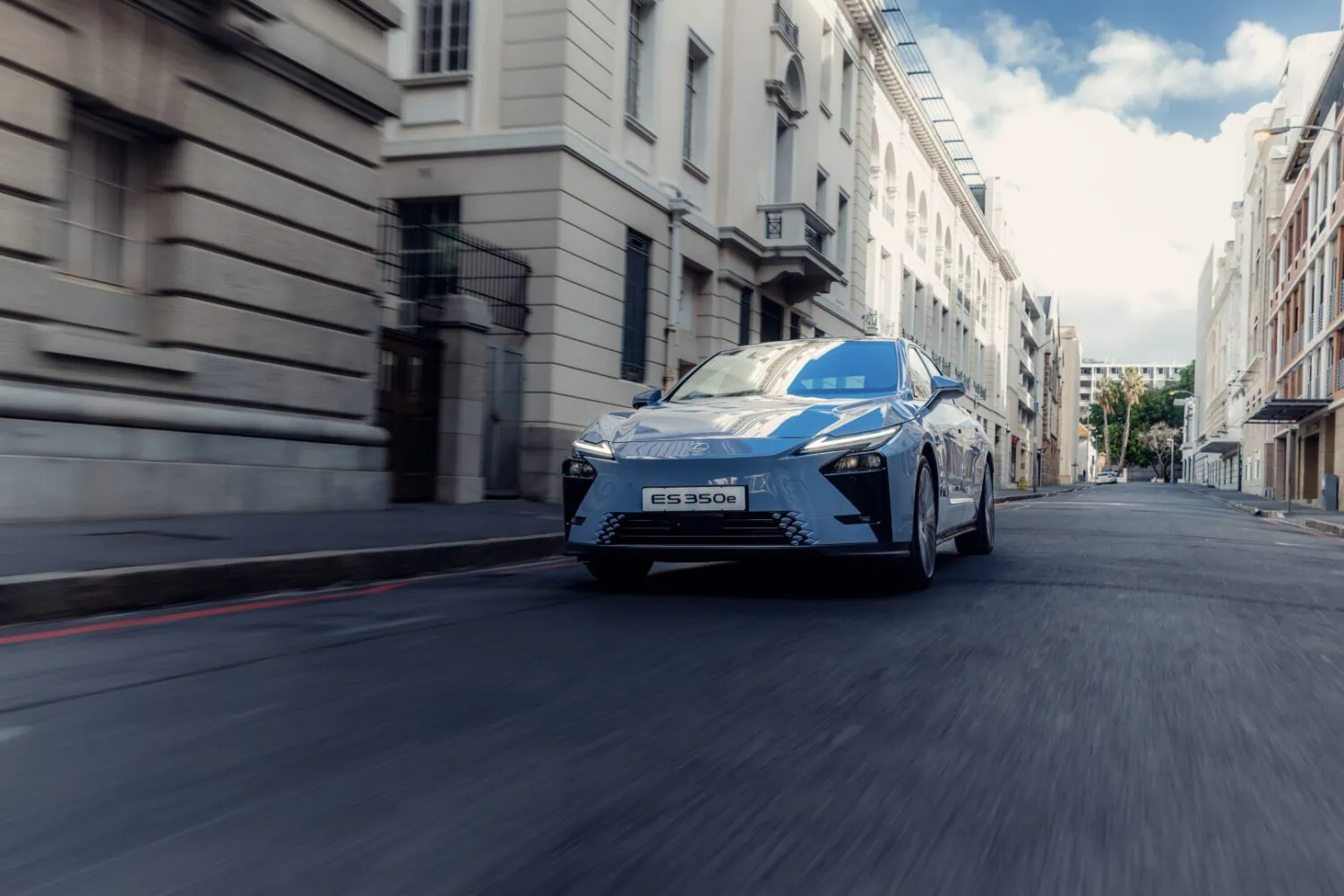 Lexus ES 350e driving through city street - Saffarazzi Lexus ES 350e driving through city street