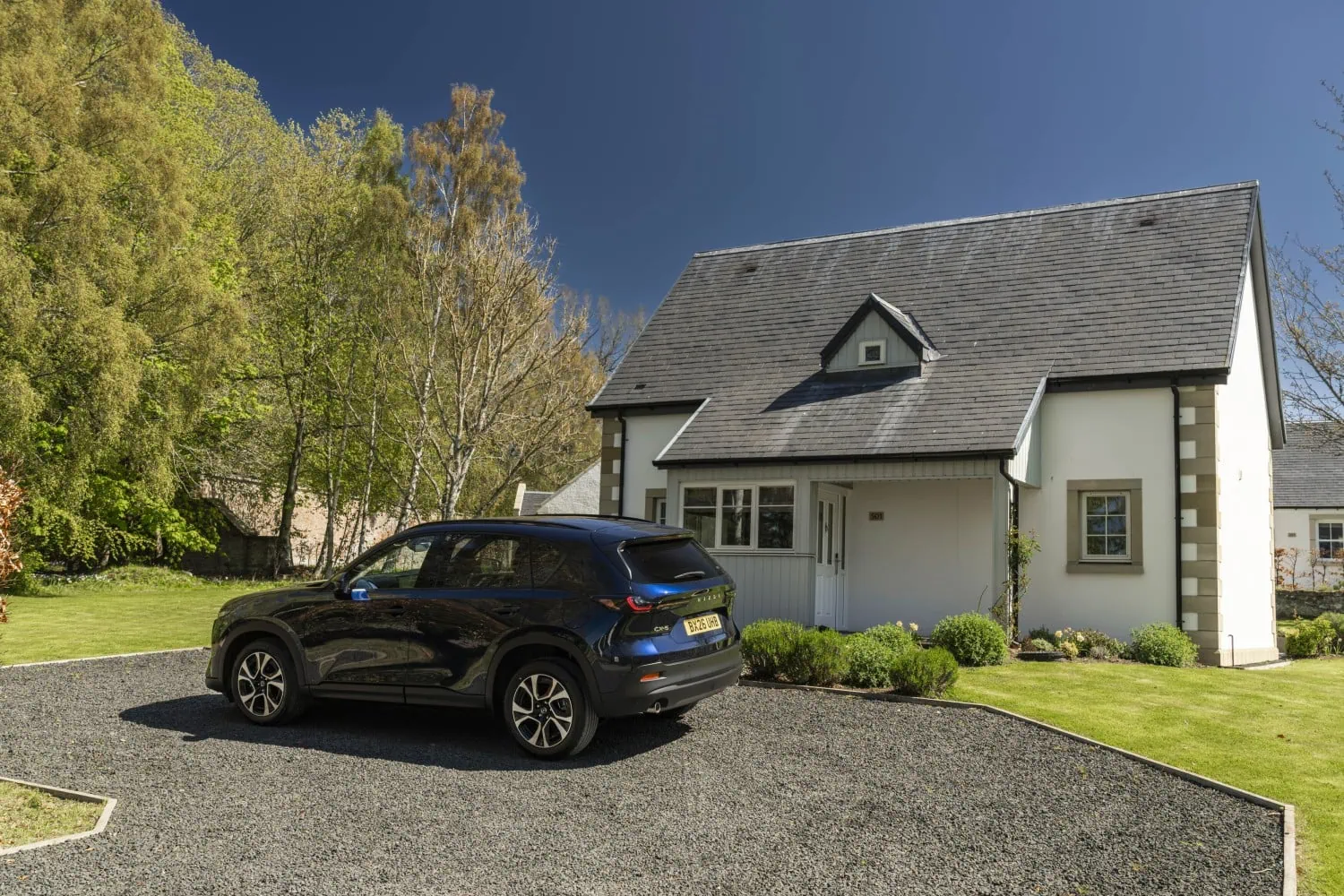 Mazda CX-5 rear by cottage - Saffarazzi Mazda CX-5 rear three-quarter view outside cottage.