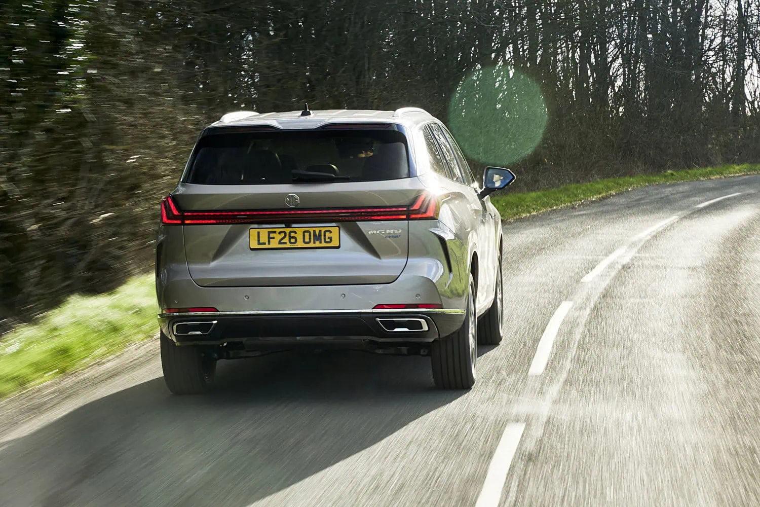 MG S9 rear on lane - Saffarazzi MG S9 PHEV rear view on winding road.