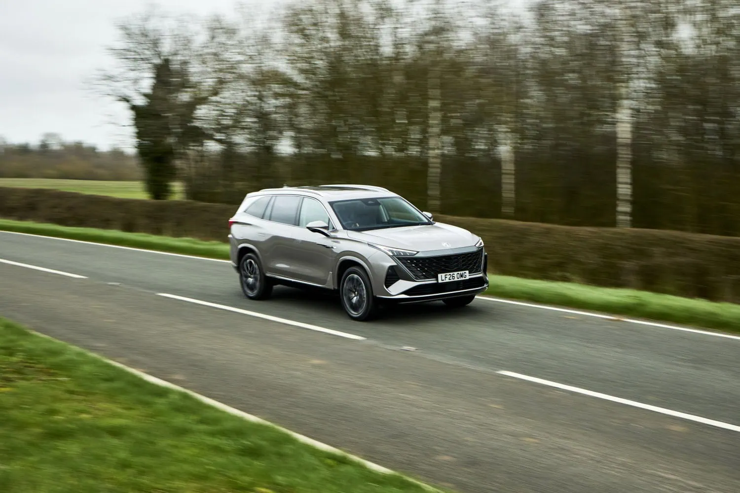 MG S9 on country road - Saffarazzi MG S9 PHEV SUV driving on country road.