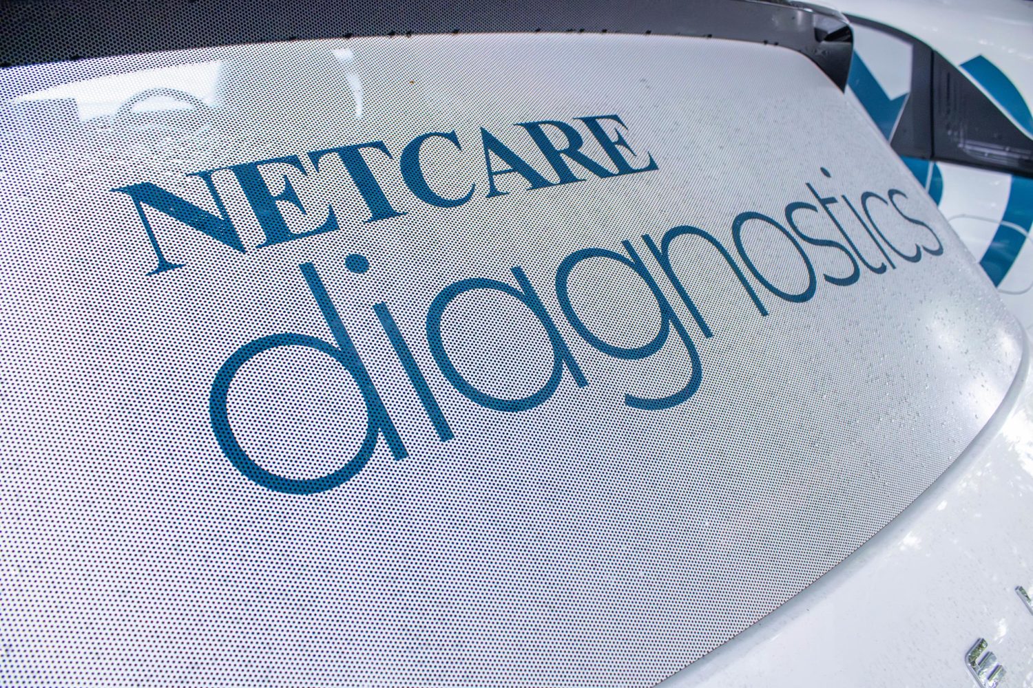 Netcare Diagnostics logo on Geely E2 rear window