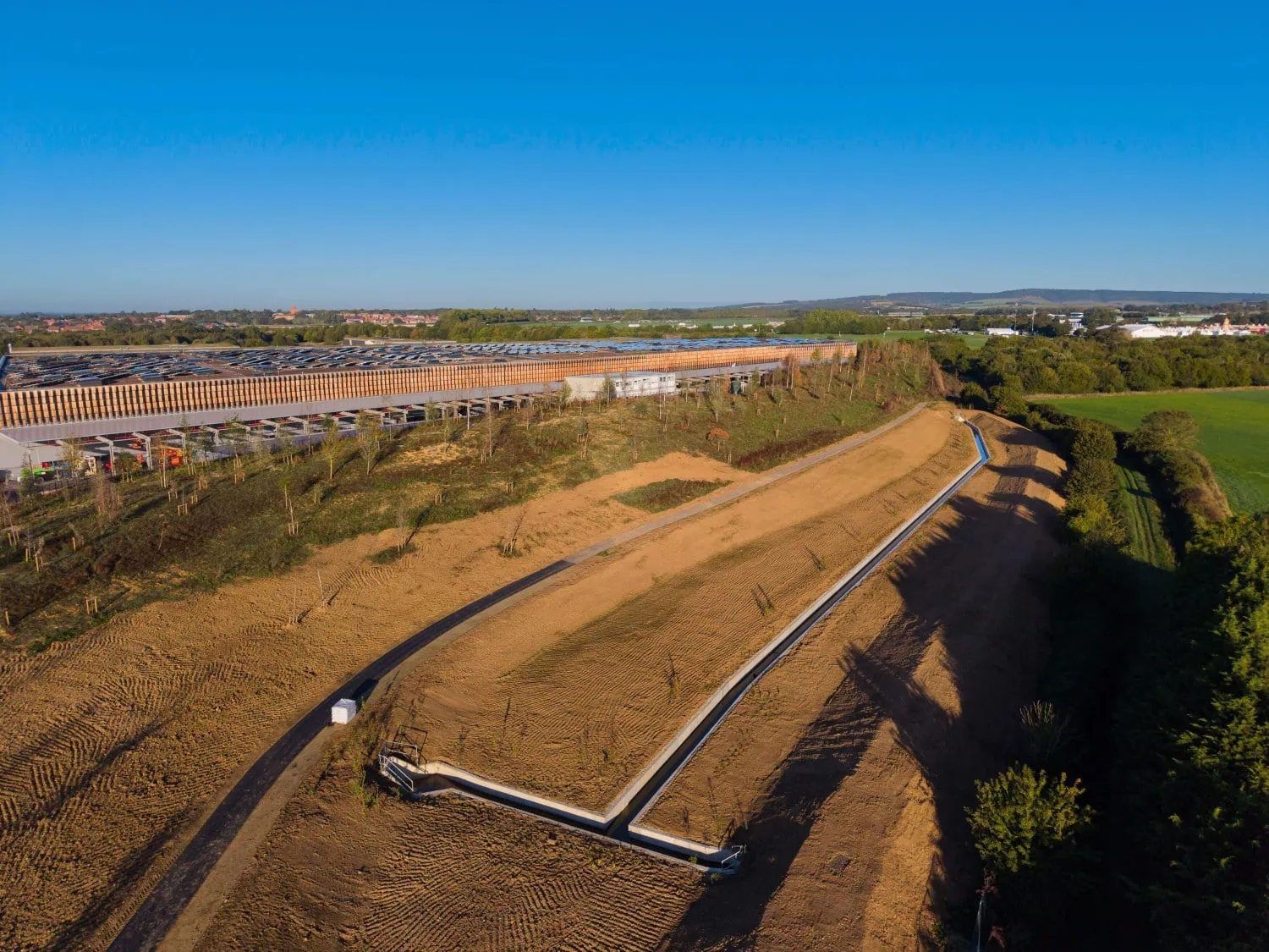 Landscaped embankment beside factory - Saffarazzi New landscaped embankment beside Rolls-Royce Goodwood facility.