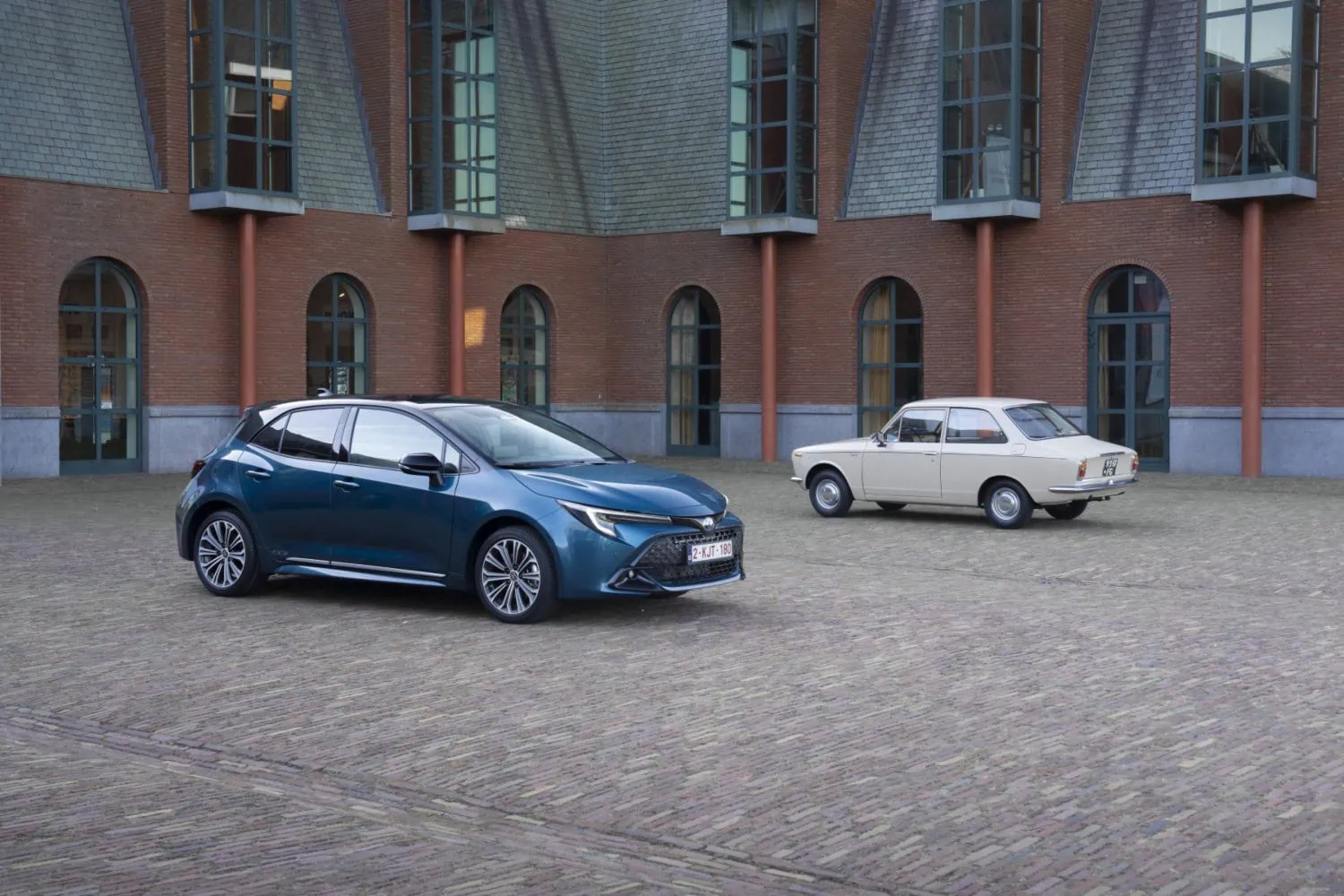 Old and new Corollas - Saffarazzi New Toyota Corolla hatchback beside first generation Corolla.