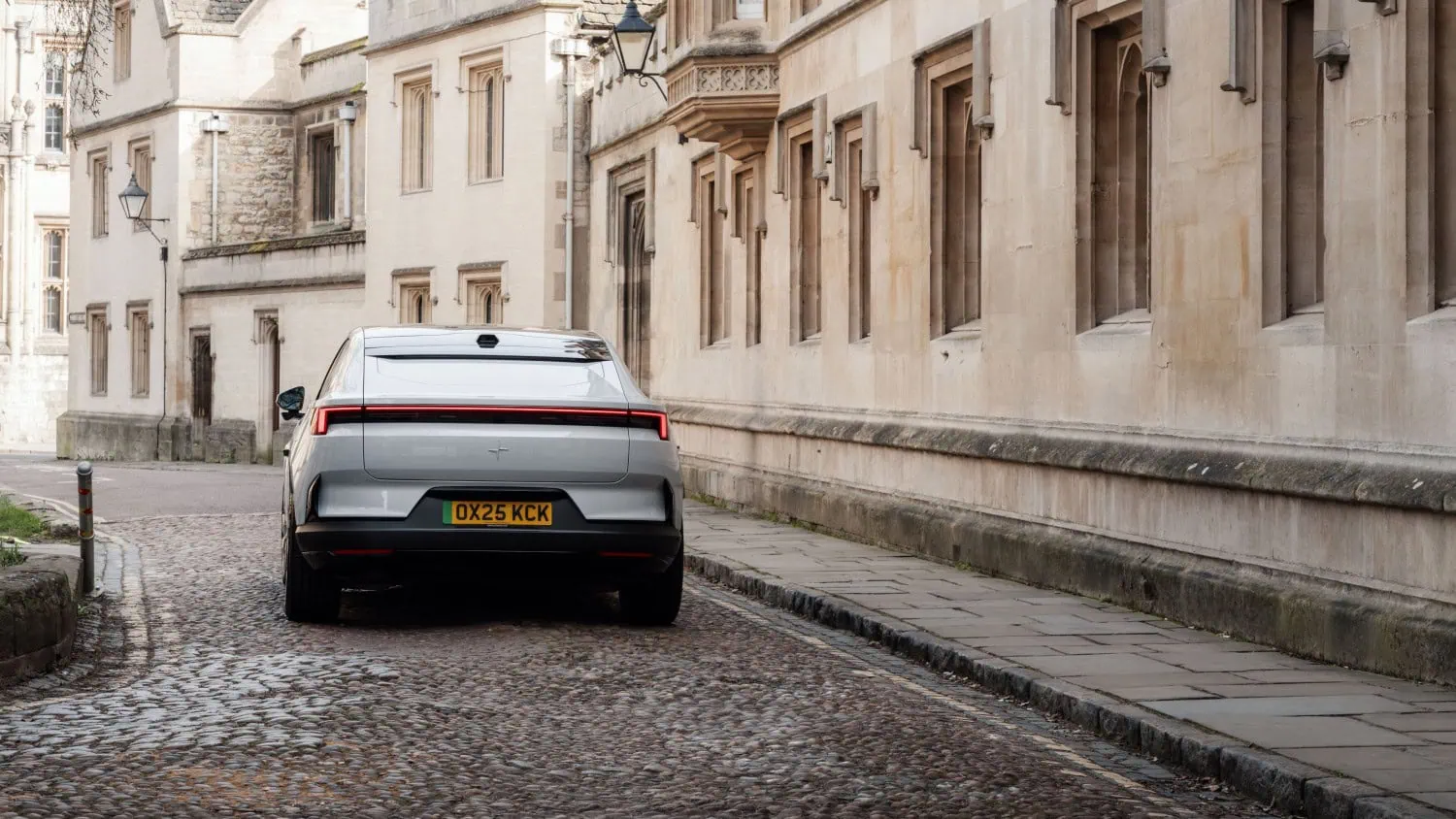 Polestar 4 on cobblestones - Saffarazzi Polestar 4 rear view on a cobbled street.
